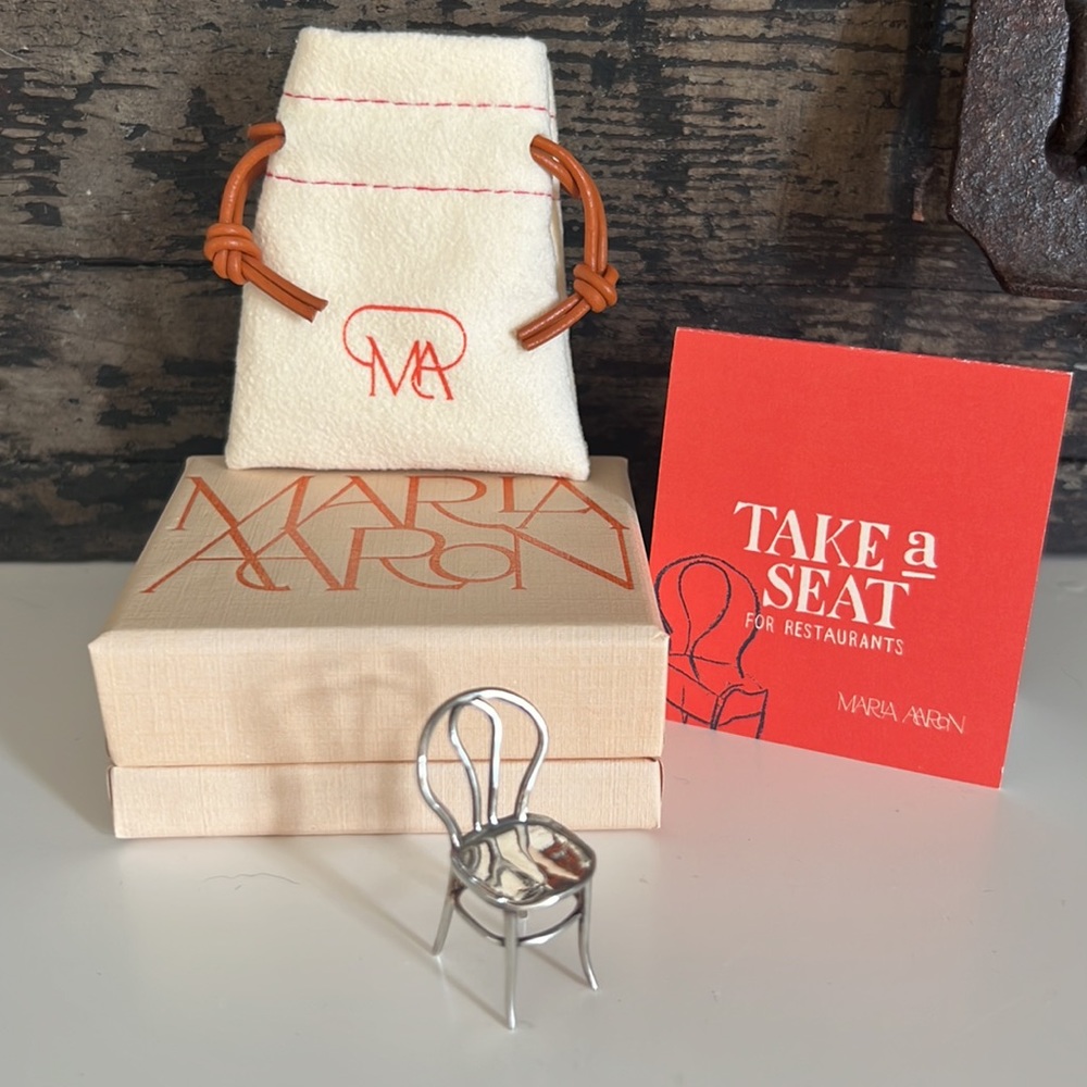 Marla Aaron take a seat for restaurants silver chair
